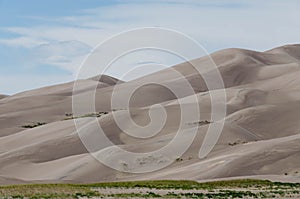 Great Sand Dunes National Park, Colorado, USA. Beautiful scenic majestic sand dunes and mountain peaks. Travel destination locatio