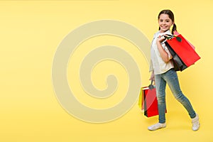 Great school shopping deals. Back to school season great time to teach budgeting basics children. Girl carries shopping