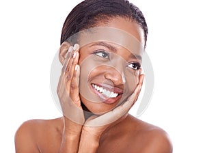 Great skin makes me smile. Studio shot of a beautiful young woman touching her skin.