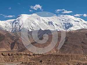 Great snow-capped mountain peak on the Pamirs Plateau