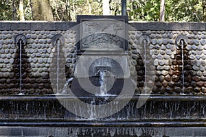 A multiple fontain in the forrest