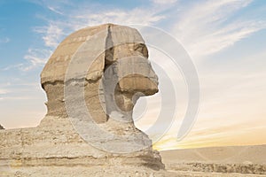 Great Sphinx against the background of the pyramids of the pharaohs Cheops, Khafren, and Mikerin in Giza