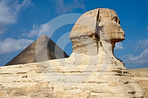 Great Sphinx on the background of pyramid in Egypt