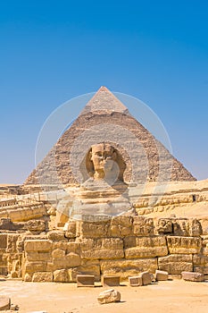 Great Sphinx of Giza and in the background the pyramid of Khafreand  Giza, Cairo, Egypt