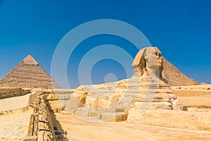 Great Sphinx of Giza on the background of the Pyramids, Cairo, Egypt