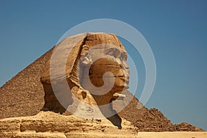 The Great Sphinx of Giza and the Great Pyramid in Cairo, Egypt with clear blue sky