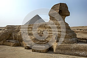 The Great Sphinx of Giza and the Pyramid of Khufu located on the Giza Plateau in Cairo, Egypt.