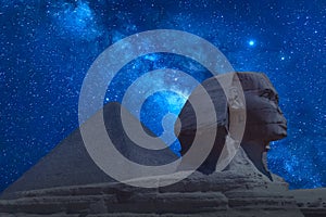 The Great Sphinx and Khafre Pyramid in Giza against night sky with stars and Milky way in Giza, Cairo, Egypt