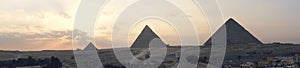 great sphinx and pyramids under bright sun. panoramic view of the Giza plateau with the great pyramids and the sphinx in the
