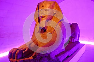 Great Sphinx of Tanis in purple illumination. Louvre Museum, Paris, France.