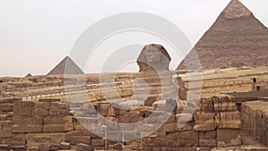 Great Sphinx on the west bank of the Nile in Giza against the backdrop of the Pyramids