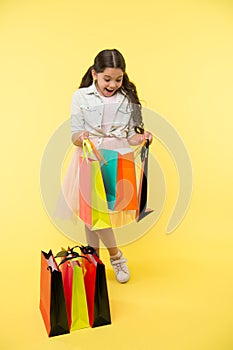 Great strategies to save on back to school purchases. Back to school season teach budgeting basics. Girl carries