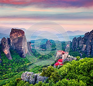 Great summer view of Eastern Orthodox monasteries listed as a World Heritage site, built on top of rock pillars. Splendid sunset i