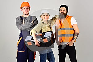 We are the great team. Construction workers team. Professional working team. Men and woman builders in workwear