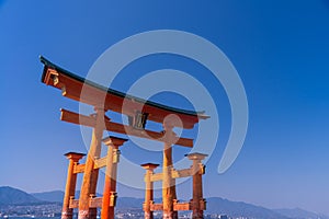 The Great Torii of Miyajima Island, Hiroshima, Japan on blue sky