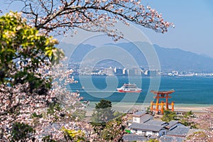 The Great Torii of Miyajima Island, Hiroshima, Japan from mountain view with ferry ship