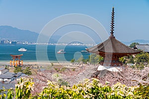 The Great Torii of Miyajima Island, Hiroshima, Japan from mountain view with ferry ship