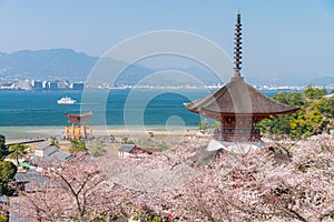 The Great Torii of Miyajima Island, Hiroshima, Japan from mountain view with ferry ship