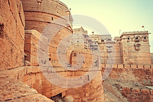 Great towers of historical Jaisalmer fort with monumental stone walls over the old city, India