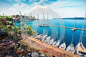 Great view of the capital of Corfu island. Colorful spring cityscape of port of Kerkira town. Sunny morning seascape of Ionian Sea