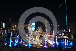 Great view of Dubai city from the water at night. United Arab Emirates.