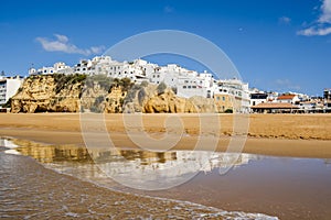 Great view of Fisherman Beach, Praia dos Pescadores, with whitewashed houses on cliff, Albufeira, Algarve, Portugal