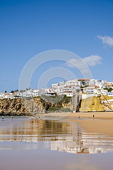 Great view of Fisherman Beach, Praia dos Pescadores, with whitewashed houses on cliff, Albufeira, Algarve, Portugal