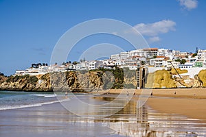 Great view of Fisherman Beach, Praia dos Pescadores, with whitewashed houses on cliff, Albufeira, Algarve, Portugal