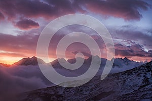 Great view of the foggy valley in Gran Paradiso National Park, Alps, Italy, dramatic scene, beautiful world. colourful autumn