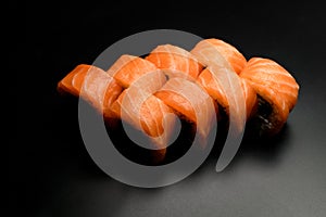 great view of Philadelphia sushi rolls with smoked salmon on a dark background