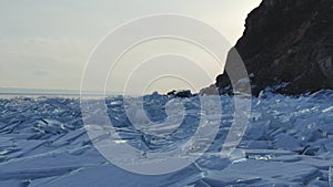 Great view of the scenery of freeze surface of the iced stones of the reservoir