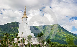 Great Vihara of 5 Buddha Images at Wat Phra That Pha Son Kaeo with mountain background