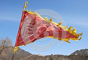 The Great Wall of China. A red flag flies over this section of the Great Wall is at Juyongguan near Beijing.