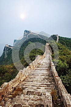 Great Wall of China with sun thru clouds.