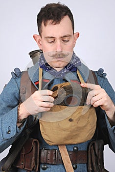 Great War French Engineer dons his gas mask