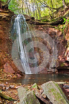 Great waterfall in the canyon in the woods. Cascade of waterfall