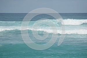 A great wave on bali beach at afternoon