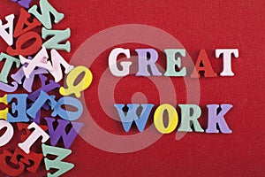 GREAT WORK word on red background composed from colorful abc alphabet block wooden letters, copy space for ad text