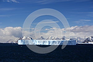 Greater Tabular iceberg swimming in the Marguerite Bay, Antarctica, Antarctic Peninsula.