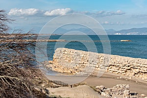 Grec Wall in Platja de Les Muscleres in La Escala behind the ruins of Empuries, in the Province of Giron, Catalonia, Spain.