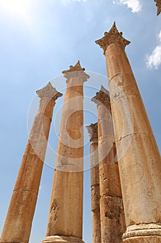 Greco-roman columns well preserved against blue sky