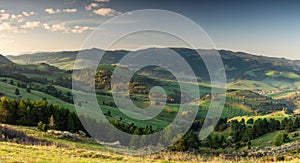 Gree hills and meadows at Pieniny Mountains. Beautiful wide spring panoramic view from. Wysoki Wierch, Poland and Slovakia