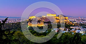 Greece - The Acropolis of Athens, Greece, with the Parthenon Temple with lights during sunset. Athens, Greece, Europe