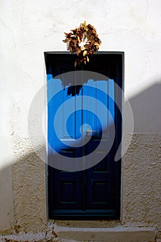 Greece, Antiparos island, typical Cycladic white house with blue door