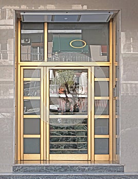 Greece Athens downtown, 60`s elegant condominium entrance golden colored frame door photo