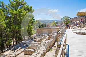 Greece, Crete. Tourists visiting the Knossos ruins, ceremonial and political centre of the tsar Minos.