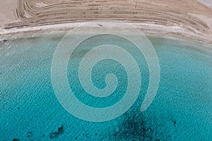 Greece, Cyclades. Sandy beach turquoise color sea water aerial drone view