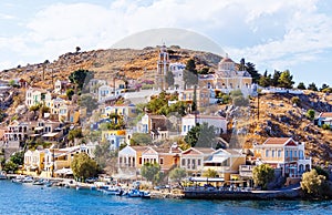 Greece. Dodecanesse. Island Symi Simi . Colorful houses on rocks