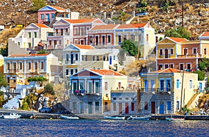 Greece. Dodecanesse. Island Symi Simi . Colorful houses on rocks