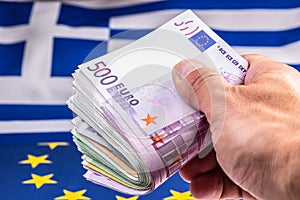 Greece and european flag and euro money. Coins and banknotes European currency freely lai